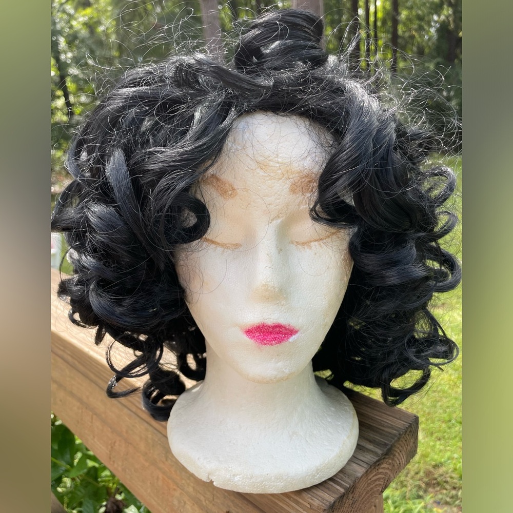 Pretty Black full of curls wig. I didn’t want to brush out the curls.